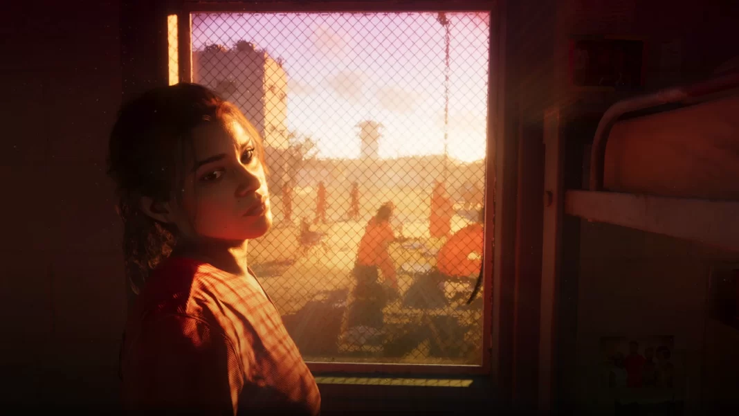 Lucia, protagonista de GTA 6, é uma mulher de cabelos escuros e cerca de 30 anos. Ela está de costas para a câmera, olhando para trás com expressão séria. Ela veste um uniforme laranja tipo macacão de presídio, e está em frente a uma grande janela de vidro opaco onde podem ser vistos os vultos de outras prisioneiras.