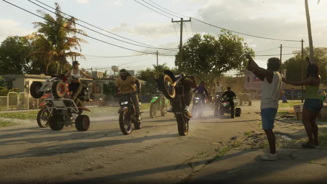 Um grupo de aproximadamente 10 motos e triciclos correndo pela rua de bairro, uma das motos sendo empinada.